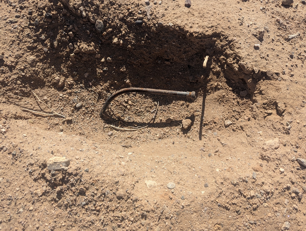 Mysterious metal rod in a hole in the ground